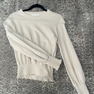 ivory, long sleeve  sweatshirt w/ adorable rushing in the sleeves & hem